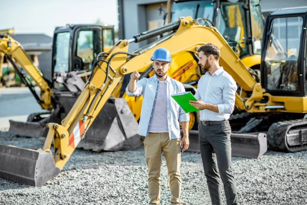 Pelleteuse sur un chantier protégée par une assurance professionnelle.